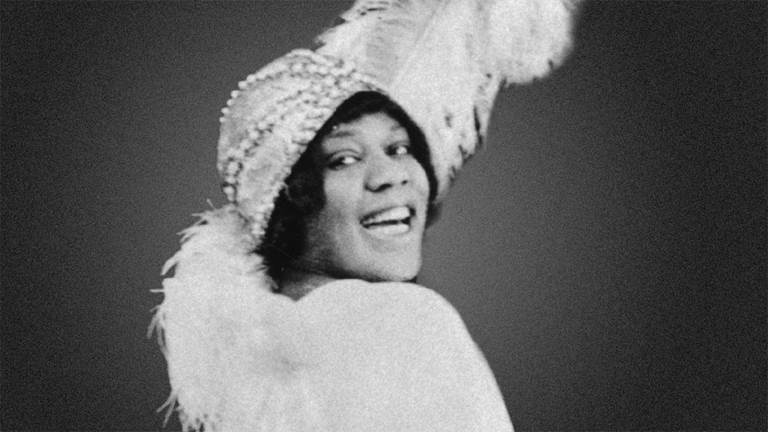 A black and white photograph of Bessie Smith. 