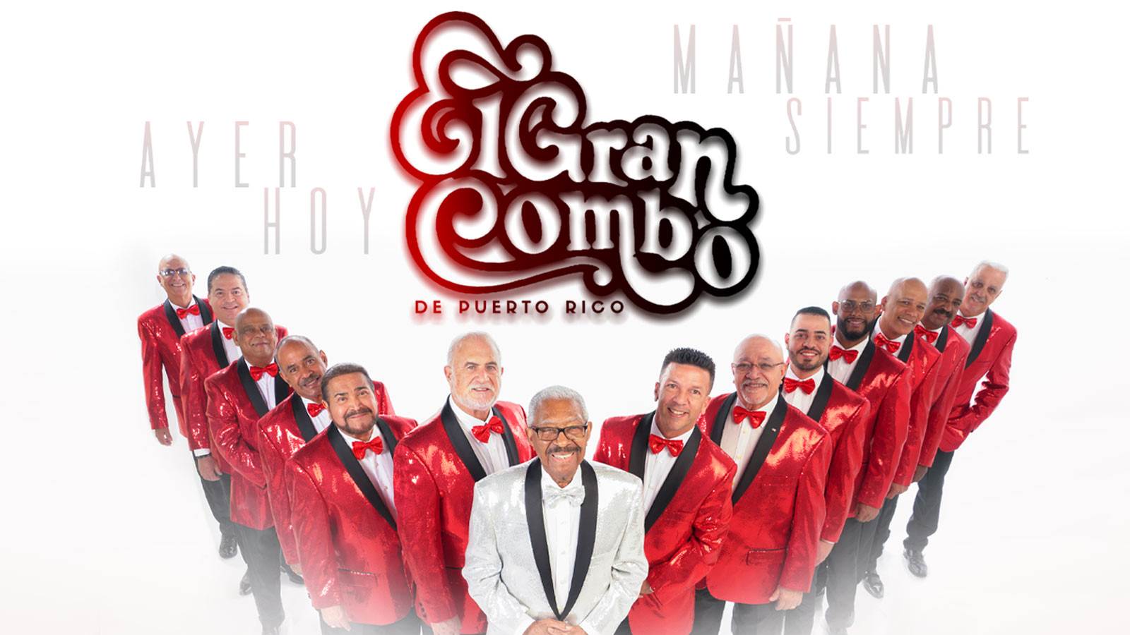 Photo of El Grand Combo wearing red suits with band leader wearing a white suit in the middle. El Grand Combo title treatment is above them.