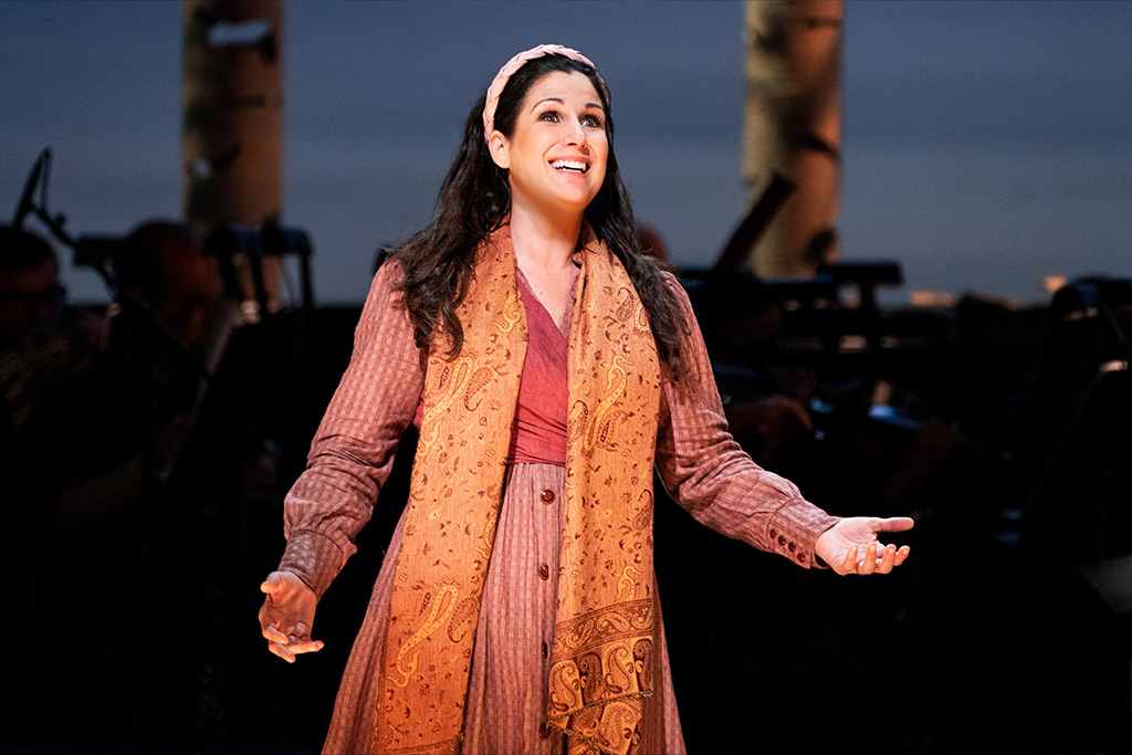 Stephanie J. Block wearing orange dress and scarf in Into the Woods