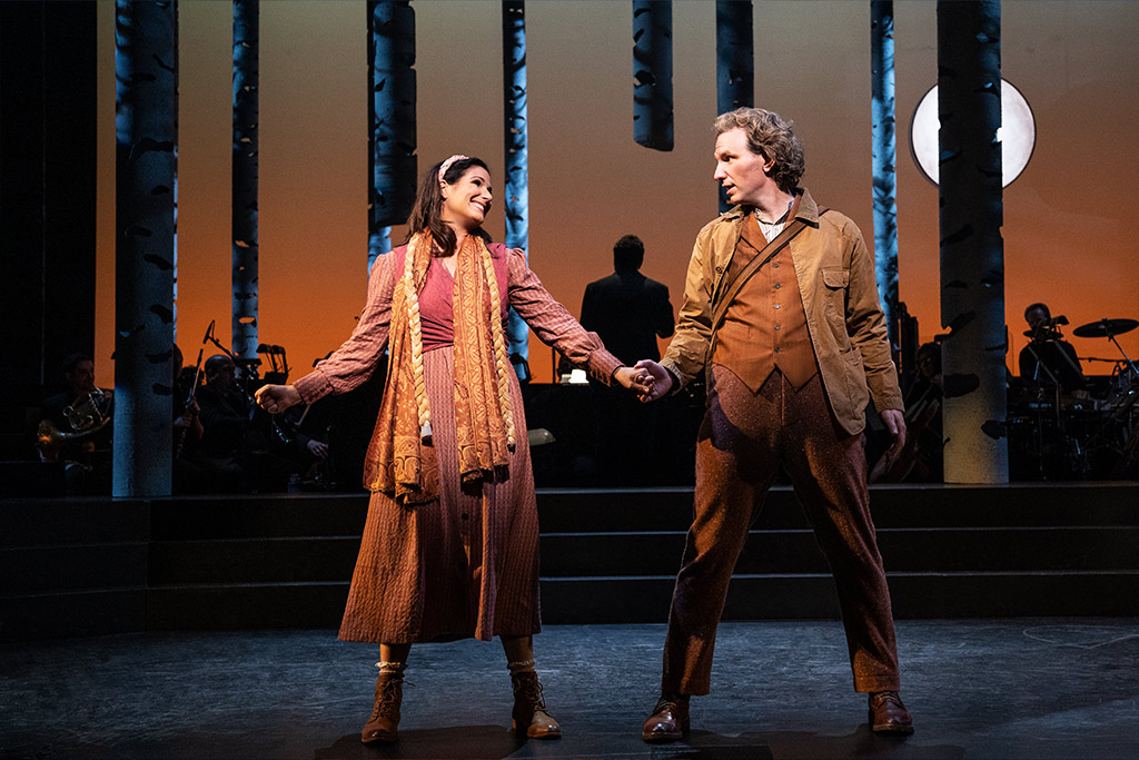Stephanie J. Block and Sebastian Arcelus holding hands on stage Into the Woods