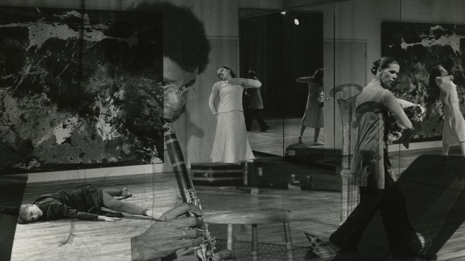 Black and white photo composite. Multiple people dancing in the room and a clarinet player is super-imposed on top of the image 