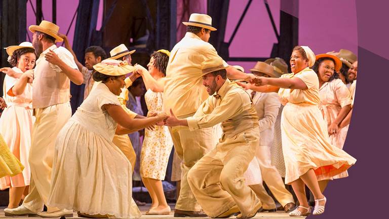 chorus at picnic dancing in celebration clothes in Porgy and Bess
